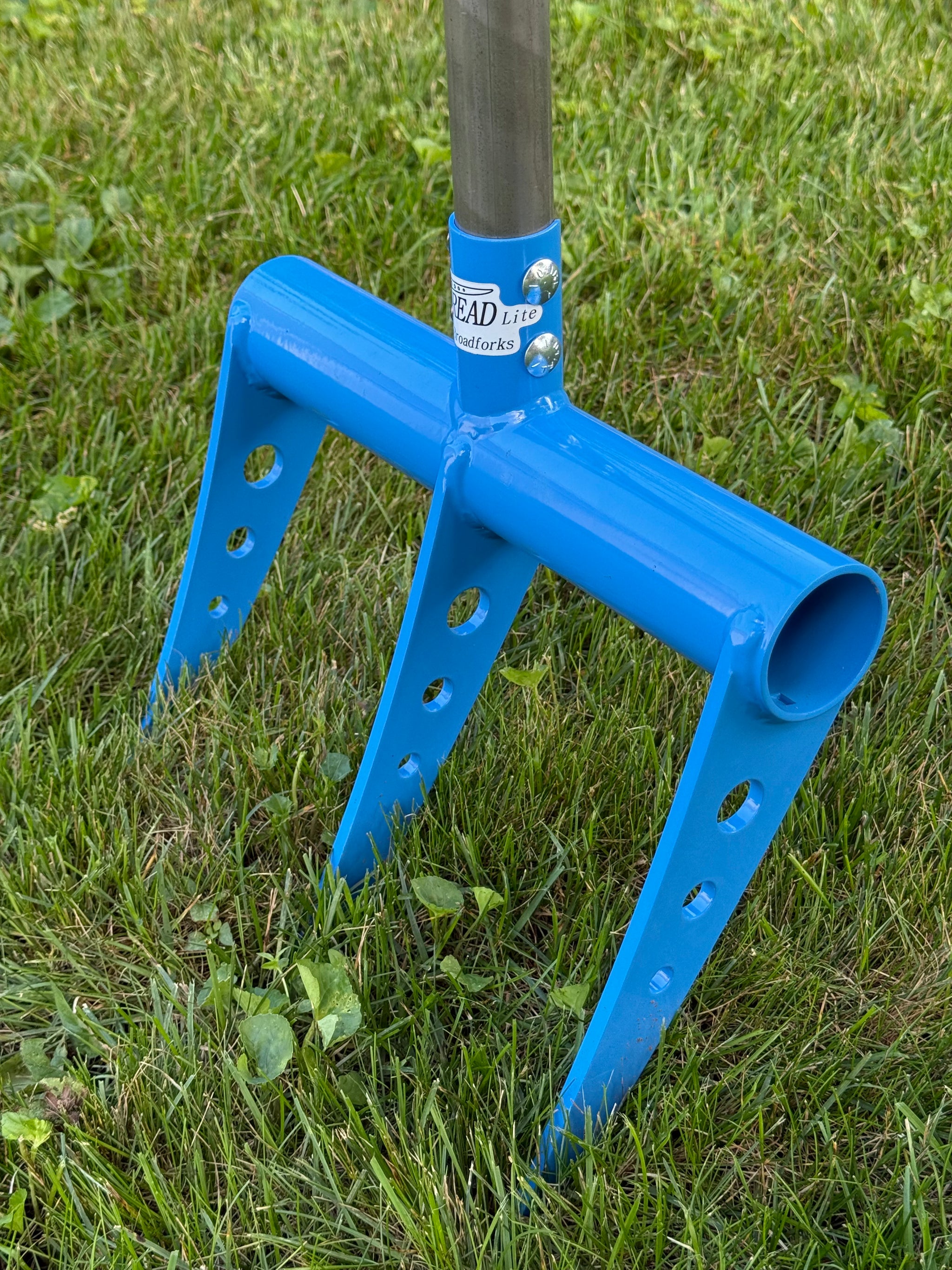 blue broadfork row style closeup